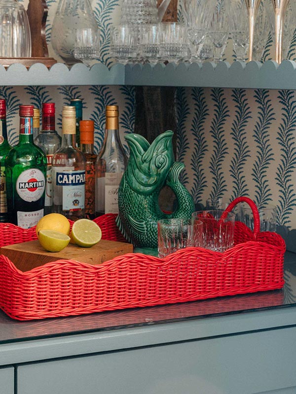 scalloped red rattan tray