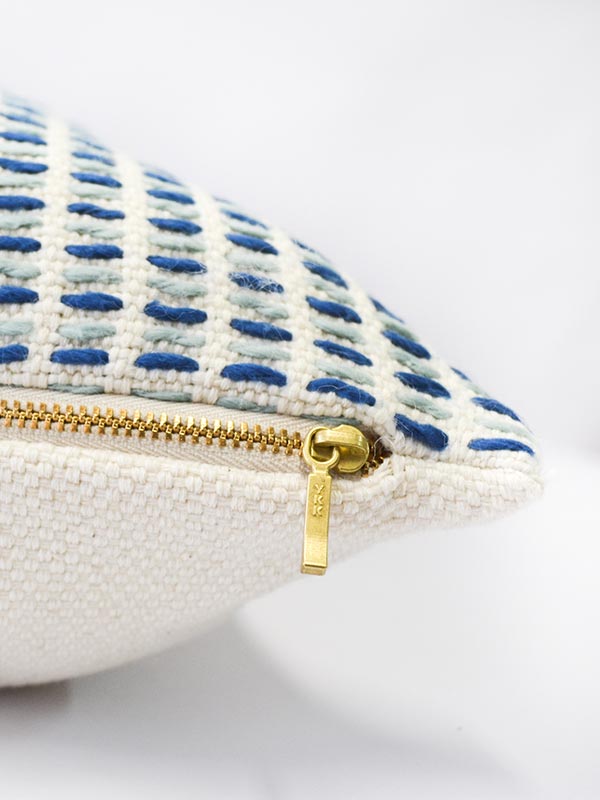 artisan made texture cream and blue accent cushion