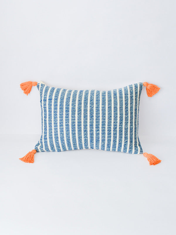 blue and white striped toss cushion with orange tassels