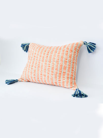 orange striped cushion with blue tassels