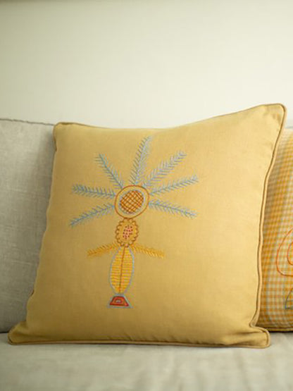 Syrian refugee embroidered yellow cushion