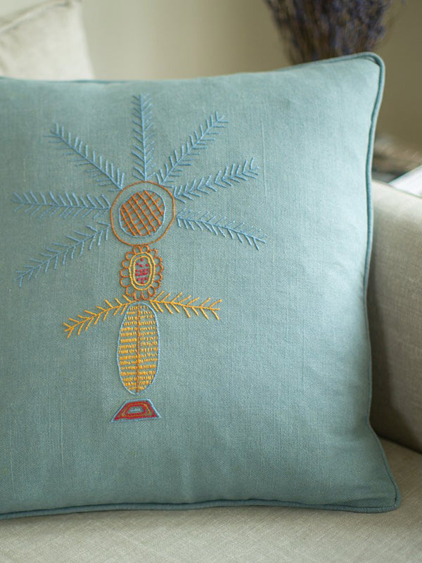 Syrian refugee embroidered blue cushion